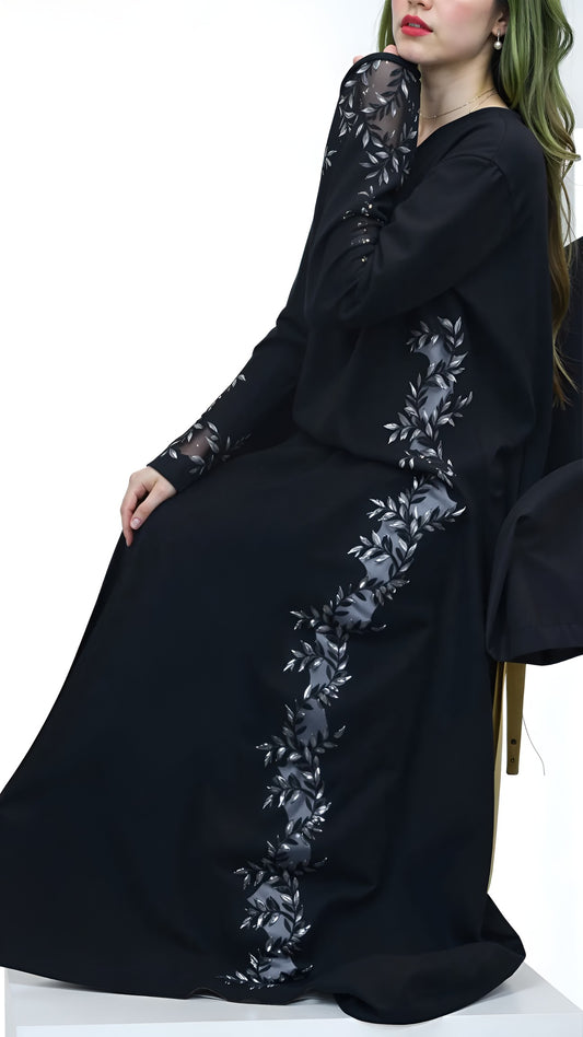 Black abaya with floral embroidery on a white background