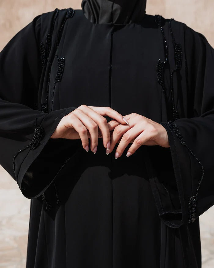 The "Onyx Blossom" Abaya – Classic Black with Intricate Detailing