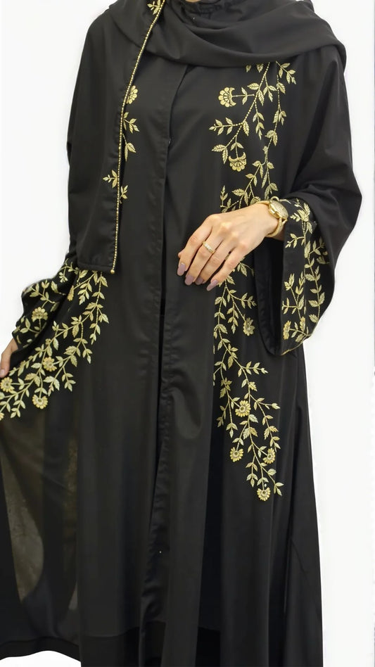 Black abaya with gold embroidery on a white background