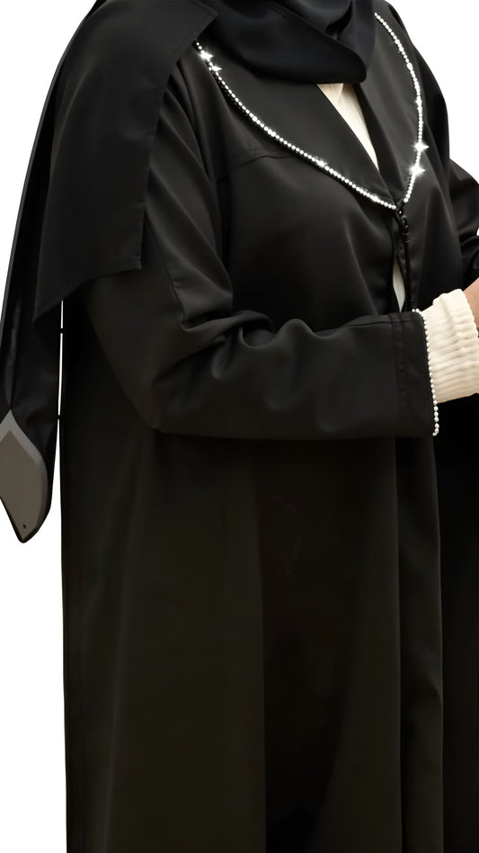 Black abaya with white trim on a transparent background