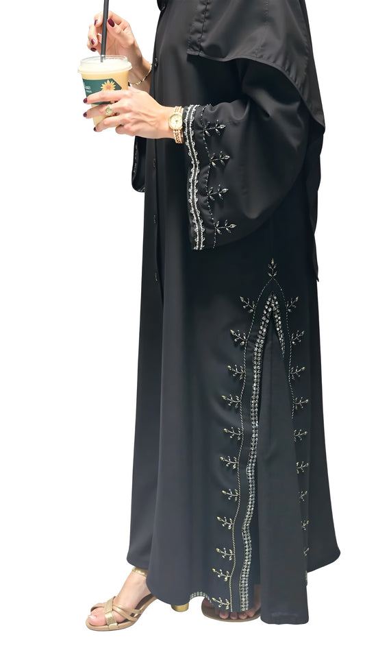 Black embroidered abaya with a white background