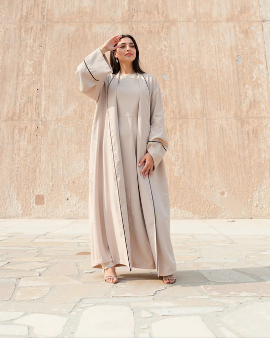 Minimalist Beige Open Abaya – Timeless Grace with Black Piping Detail