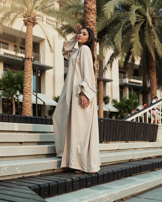 Minimalist Beige Open Abaya – Timeless Grace with Black Piping Detail