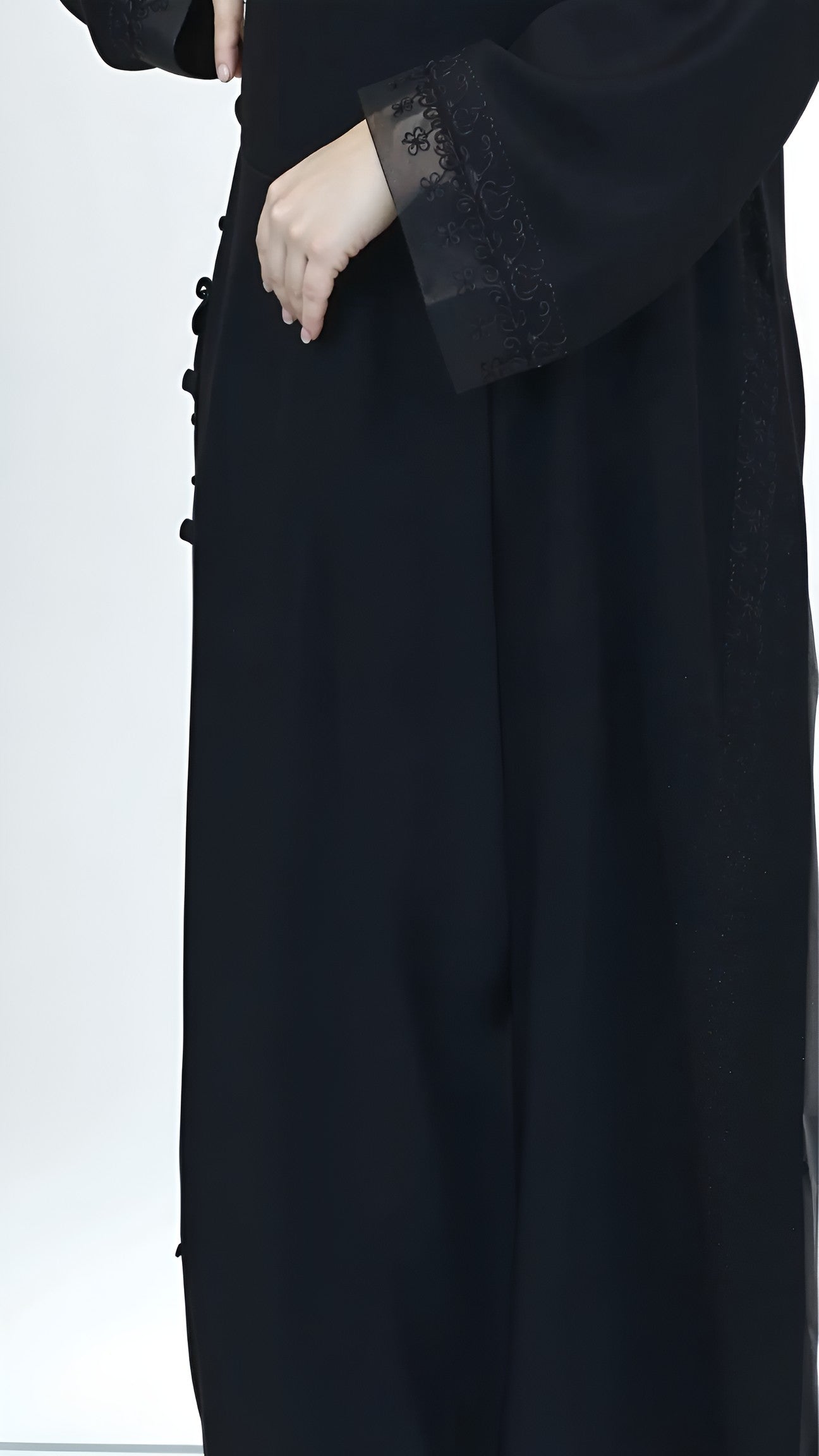 Black coat with lace cuffs on a white background